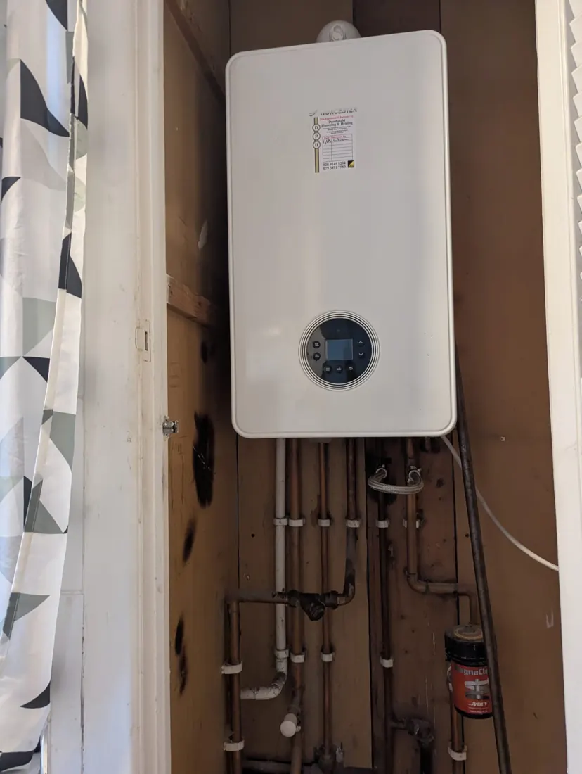 Gas combi in a cupboard &ndash; Worcester Bosch, by Dundonald Plumbing & Heating